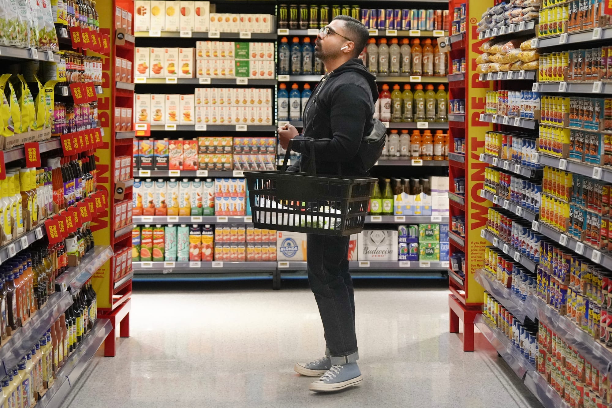 A customer looks at condiments at a No Frills grocery store in