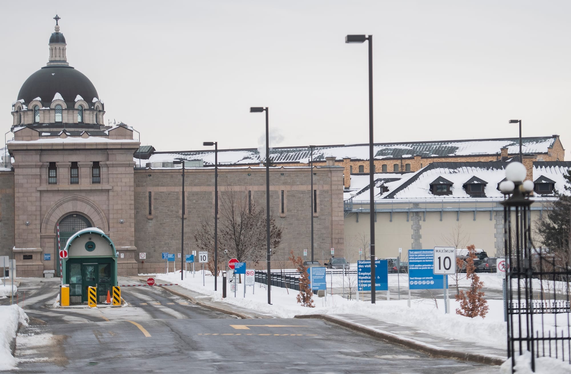 The Bordeaux Prison in Montreal, a grey stone building, is seen on a snowy day in February.