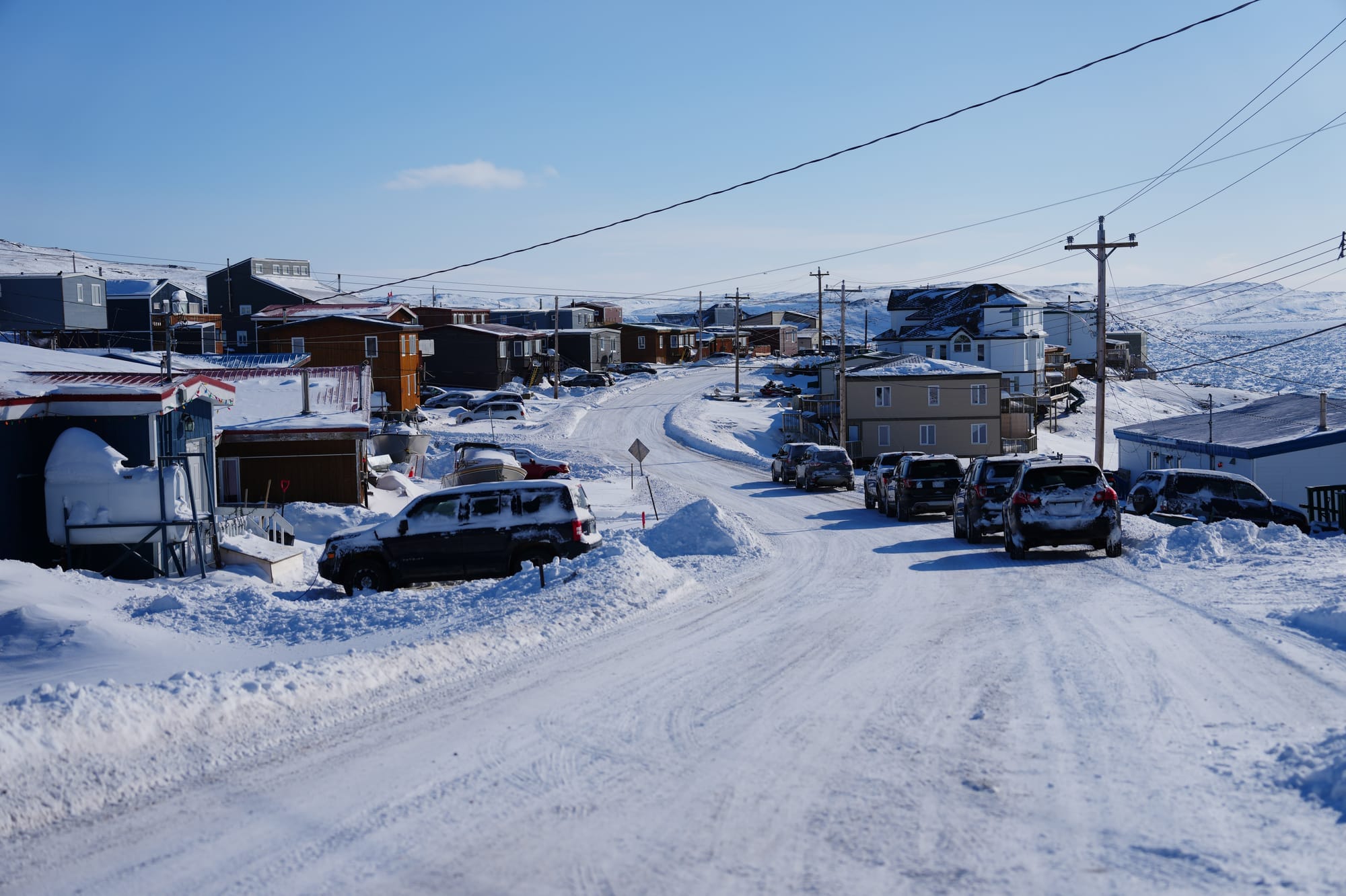 The snowy streets of Iqaluit are shown.